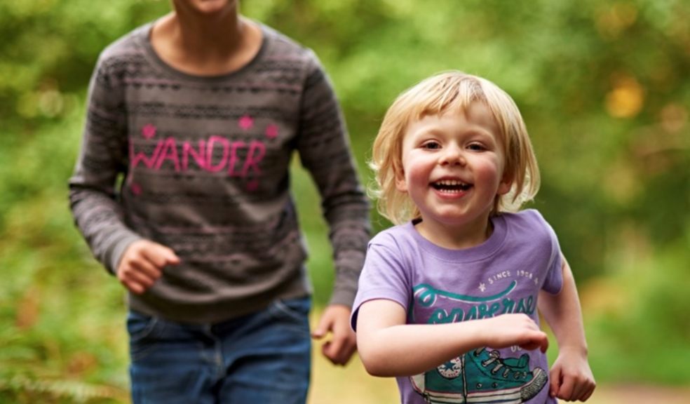 Two young girls running along an RSPB nature reserve path by Stephen Morgan (rspb-images.com)
