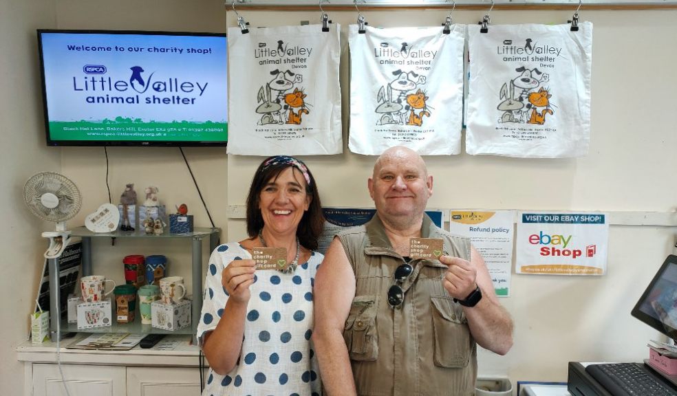 Dawn Key, Retail Manager for RSPCA Little Valley Animal Shelter, and volunteer George Kemp with The Charity Shop Gift Card.