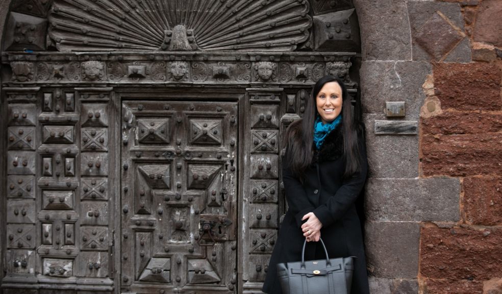 Rachel Buckley from The Family Law Company Family lawyer standing in front of gate