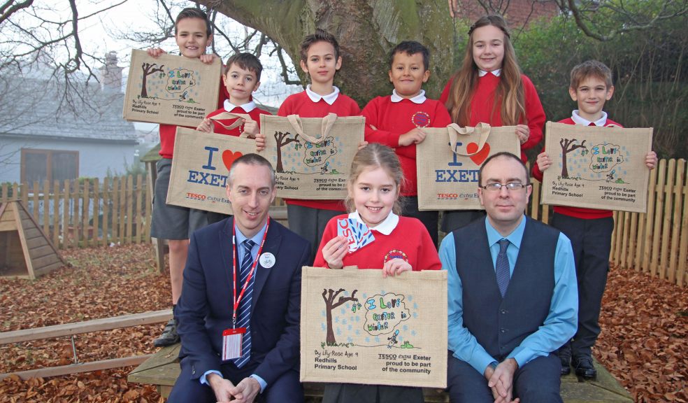 Pictured from back left at Redhills CP are Cedar class pupils Daniel Oliver, Cameron Norah -Fleming, Nicolas Anghel, Tyrone Mulgrue, Ruby Bennett, Olli Partridge. Front left Tesco Customer Experience Manager -Neil Barnes, Competition winner with winning design and Tesco vouchers for £25.00 to Lily -Rose Leach, School Head -Mr Stuart Busby. Picture by Paul Hamlyn.