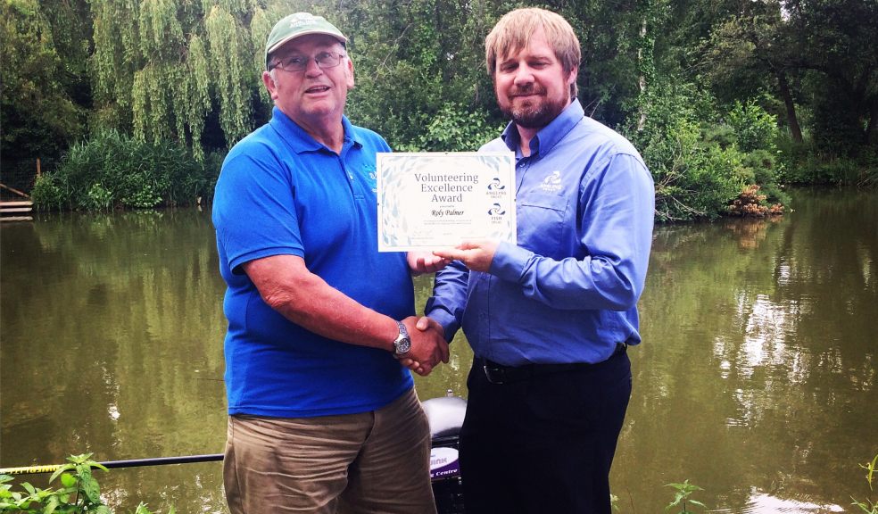 Roly Palmer with his award from the Angling Trust
