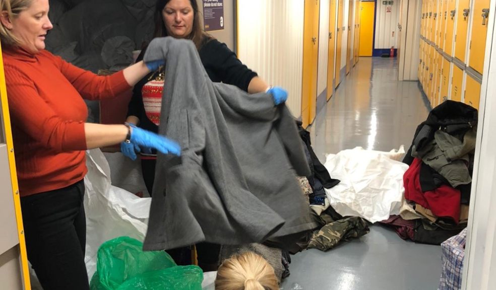 Rotary Club WrapUp campaign - volunteers sorting coats at Safestore.jpg