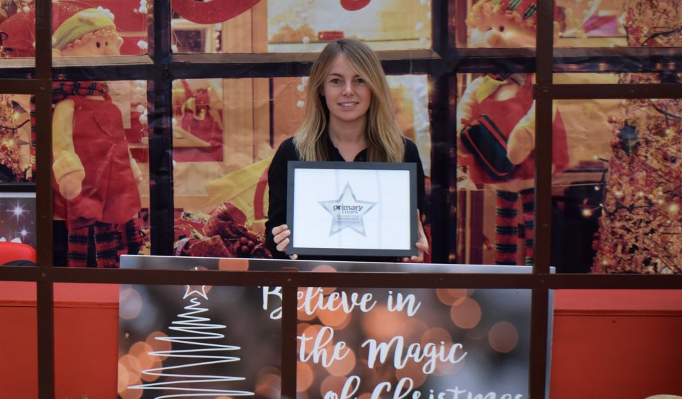 Otter Garden Centres Creative Director Sabine Jary with award Woman holding certificate
