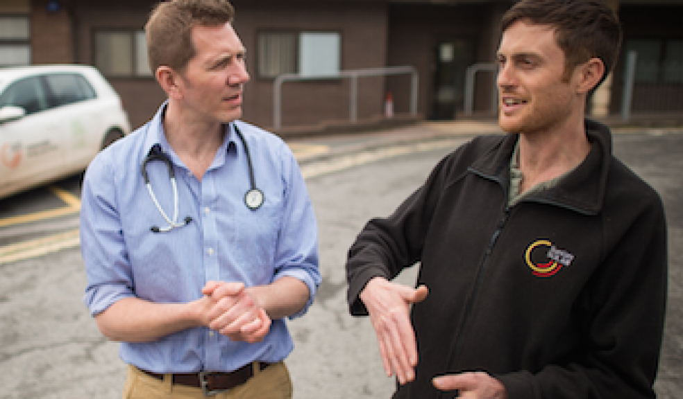 Solar expert, Kevin Ciolino (left), explains the workings Mount Pleasant Health Centre's solar system to the centre's Dr Paul Hyman