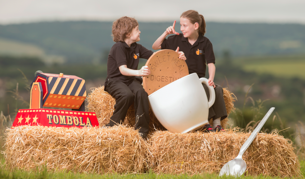 Exeter Deaf Academy students Kim and Alex enjoy a traditional British family day out at Fete in the Field. Image: Steve Haywood