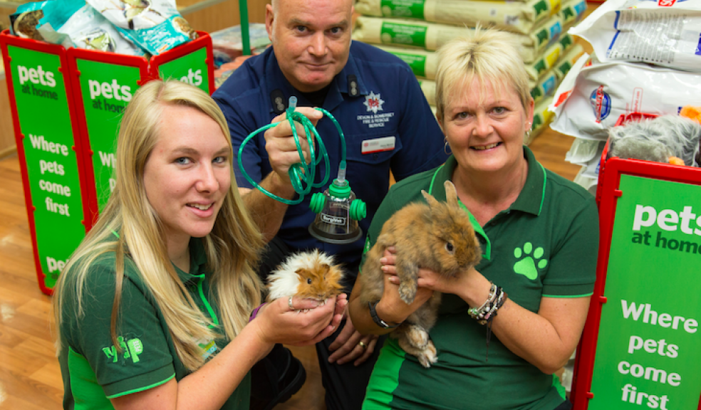 Pets at Home store manager Caris Waitimas and her colleague (R) Steph Melluish with Garry Moore of Devon & Somerset Fire & Rescue Service at the handover of the ‘Smokey Paws’ breathing equipment. Photos: Tony Charnock Photography