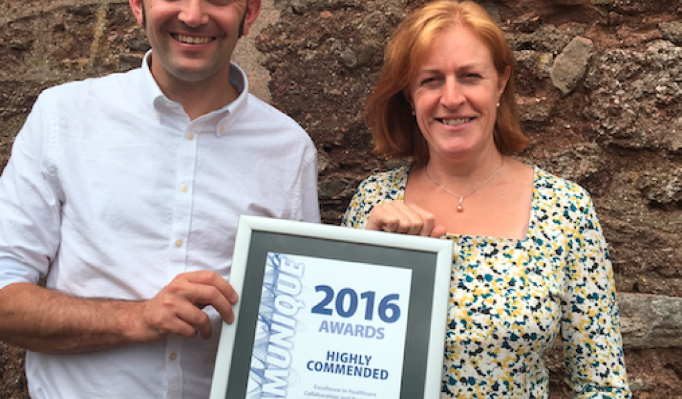 RISE Contracts Manager Jon Cook and Dr Teresa Pointing holding the award