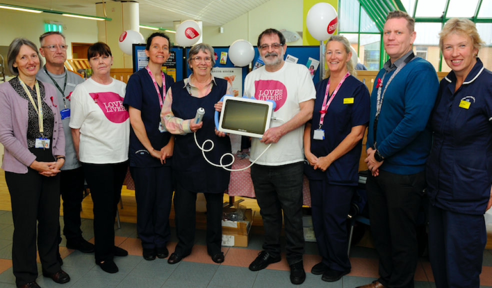 Members of the Hepatology Team with Norah Wightman and Jim Baker from , Exeter Liver Patient Support Group (in the white t-shirts) and Kate Caldwell, Treasurer of the RD&E League of Friends (pictured centre).