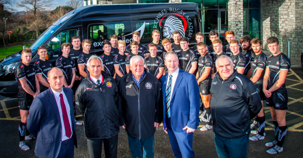Celebrating the winning Partnership between Exeter Chiefs and Exeter College: Pictured (back) are the Exeter College rugby team, who recently won the AASE League Championship Final, with (front), Rob Bosworth, Vice Principal – Schools, Partnerships and Curriculum, Exeter College, Steve Byrne, Academy Director, Exeter Chiefs Rugby Academy, Tony Rowe OBE, Chief Executive and Chairman, Exeter Chiefs, John Laramy, Principal and Chief Executive, Exeter College, and Rob Gibson, Exeter Chiefs Academy.
