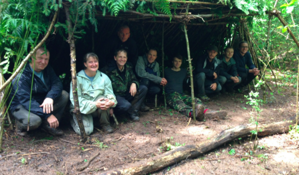 People in a shelter they have built
