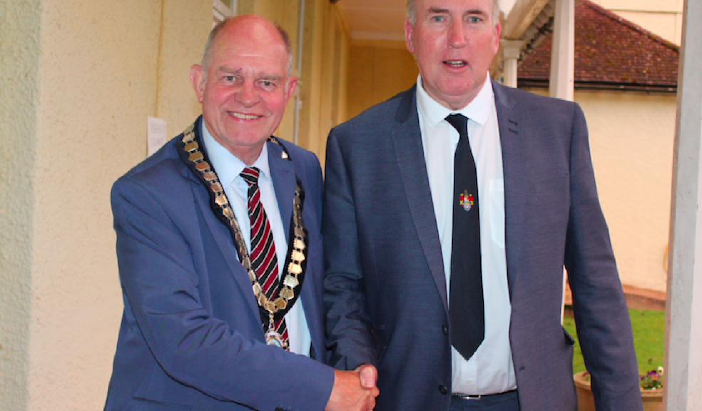 Pictured is new East Devon District Council Chairman Cllr Andrew Moulding with retiring Chairman Cllr Stuart Hughes.