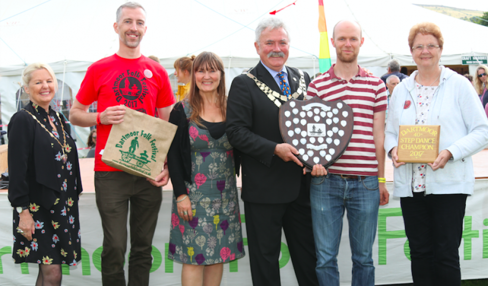 Matt Norman, fifth left, receiving the Dartmoor Step Dance Championship title from the Mayor of West Devon, Cllr Jeff Moody, with from left, Mayoress, Mrs Beverley Moody, championship runners-up Jason Rice and Lisa Sture and right, Shirley Bazeley, president.