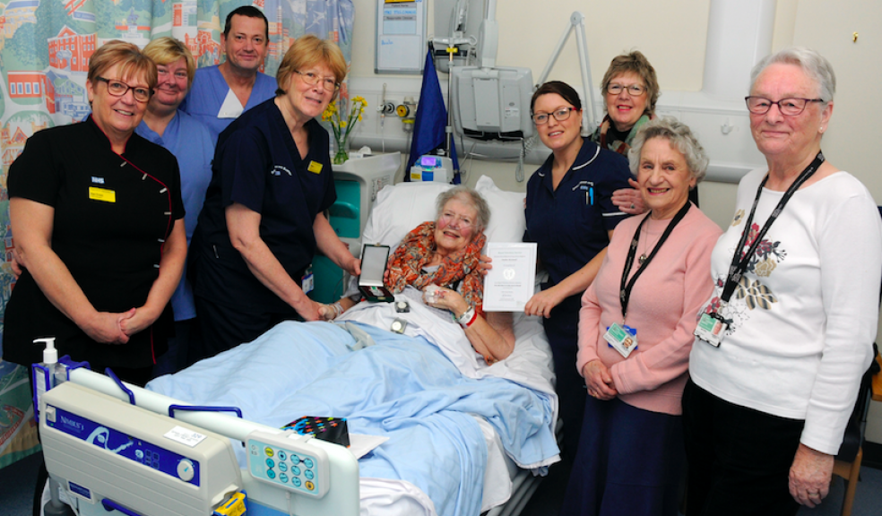 Volunteer Paula McConnell (pictured centre) received her RVS Long Service Award from Senior Nurse Lisa Vogwill at the Royal Devon and Exeter hospital, with friends and colleagues, and RVS co-ordinator June Harry (pictured far right).