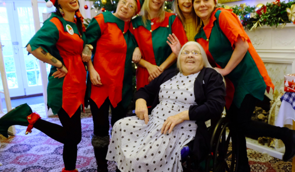 Elves from the Rise Care Home with a resident enjoying festivities.
