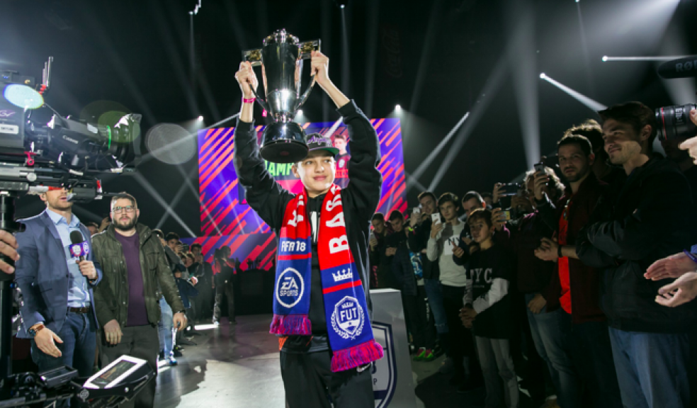 16-year-old Donovan “DhTekKz” Hunt from the UK lifts the trophy as the FIFA Champions Cup Barcelona Winner