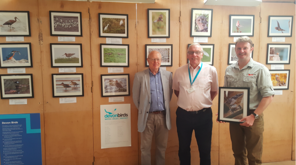Viewing the exhibition are, from left, Shaw Edwards, vice chairman of Devon Birds, Cllr Tom Wright, East Devon District Council portfolio holder for the environment, and James Chubb.