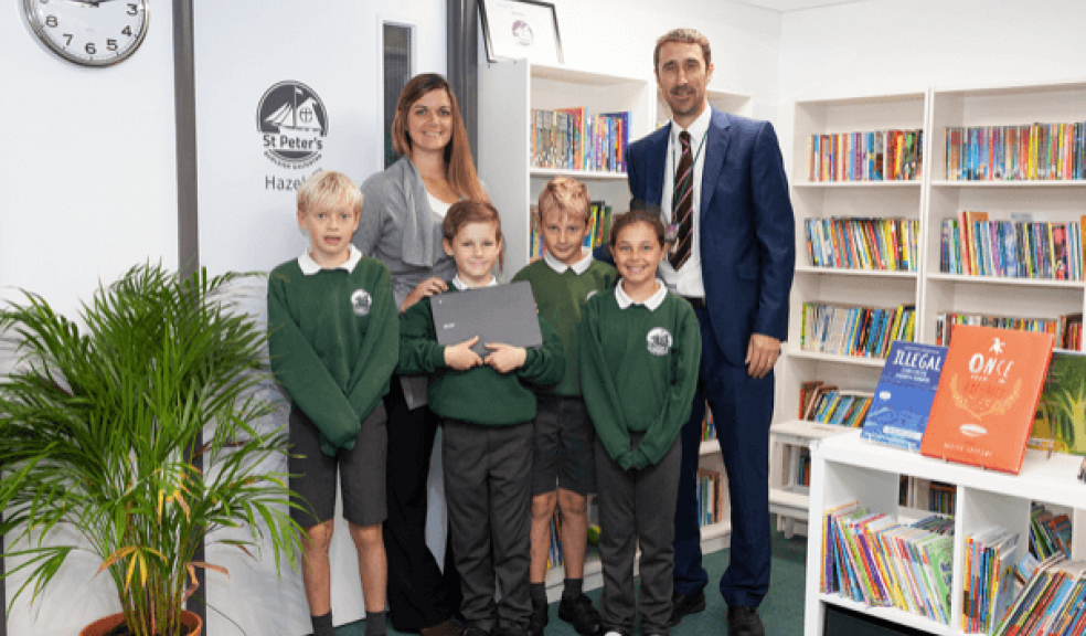 Laura Hill – (Nexus Technical Assurance Team Leader), Steve Hitchcock (Headmaster) and students from St Peter’s C of E Primary School Budleigh Salterton receiving the donation of a new laptop.