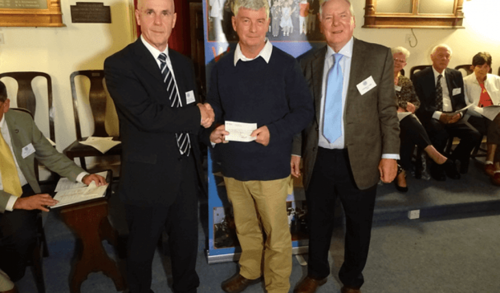 Shaun Gibbons receiving the cheque from Nicholas Ball accompanied by Bro. Bob Buckley from St. Michaels Lodge.