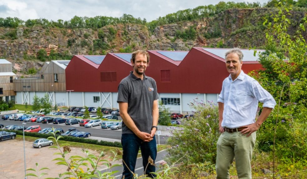 Gabriel Wondrausch (left) and Charlie Bigham in front of the 300 kW solar PV system at Dulcote quarry.
