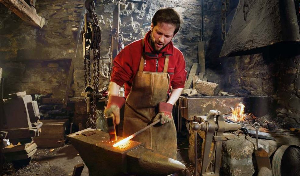 Shaping metal on the anvil. Photo: John Millar, National Trust Images 