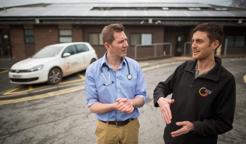 Solar expert Kevin Ciolino explains the workings Mount Pleasant Health Centre's solar system to the centre's Dr Paul Hynam