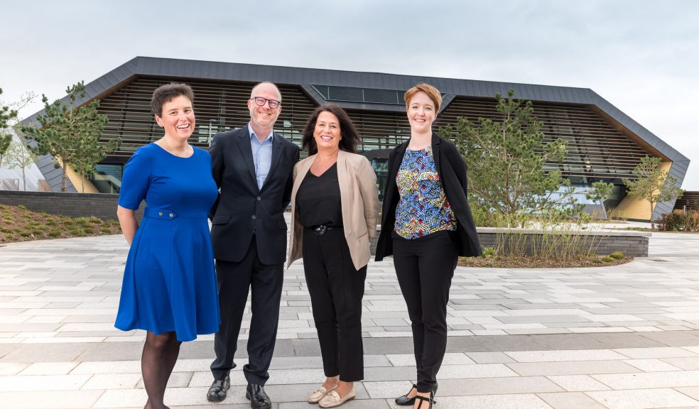 L-R: Maureen de Gori de Murden of Exeter City Council, Tim Wadsworth of Space, Jo Caine, Exeter Chamber Director and Grace from Space at the Met Office Supercomputer, one of Exeter’s latest and most modern collaborative workspaces.