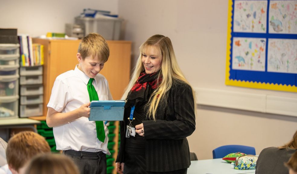 Student and teacher using Sparx on tablet computer