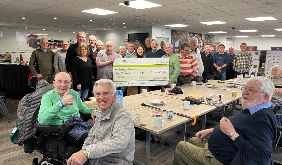 Photo: Members of the Sporting Memories group accept a cheque from Jo Towns, Marketing Manager at BDWH Exeter.