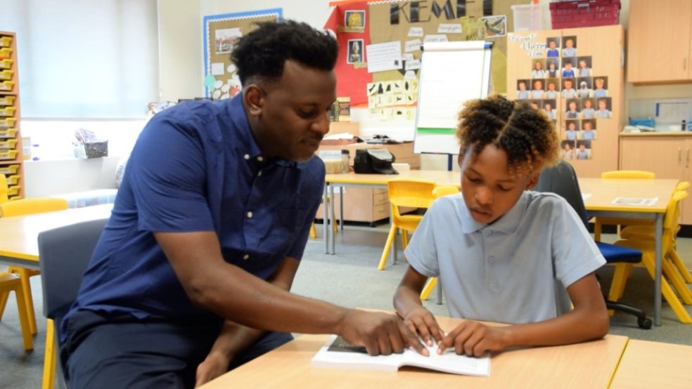 Stuart Lawrence with a pupil at Beecroft Garden School