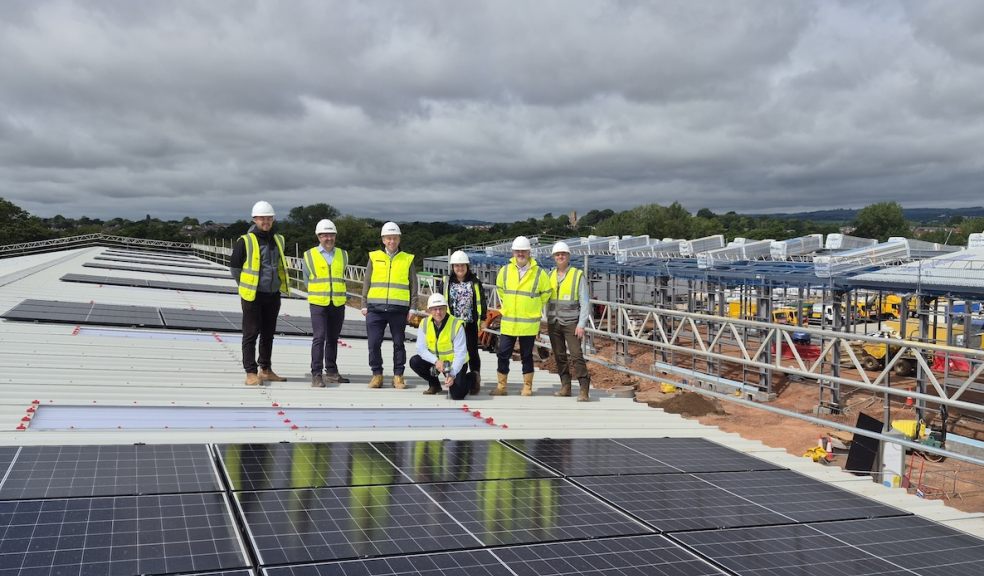 Team members from Summerfield and Devon Contractors on the roof of Westpark 26 Business Park in Well