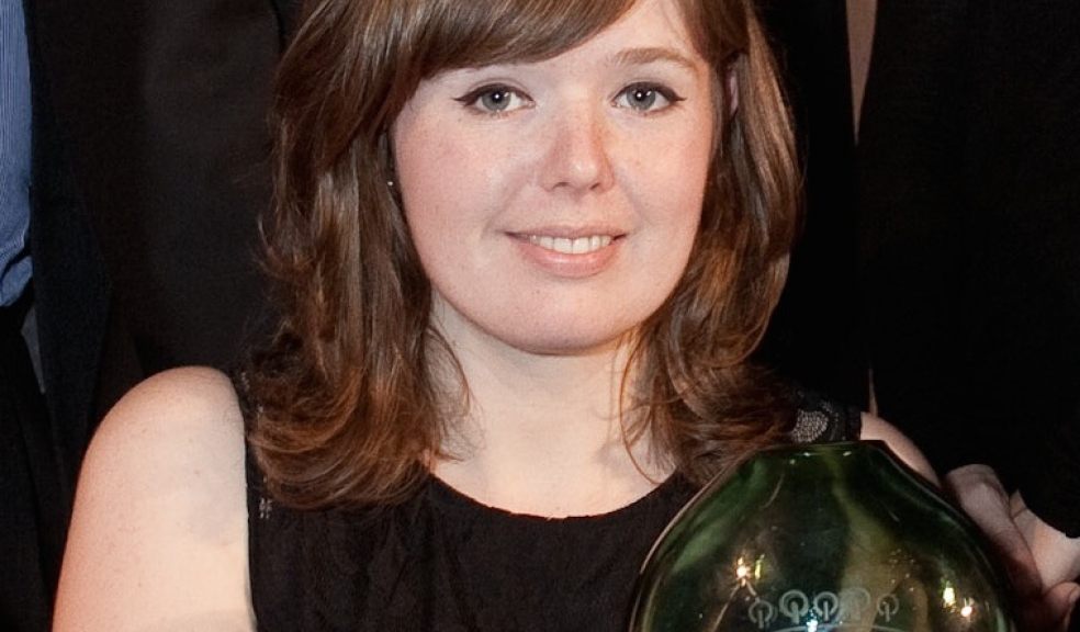 SunGift Director Ellen Rodger with one of the company's previous Green Energy Awards accolades