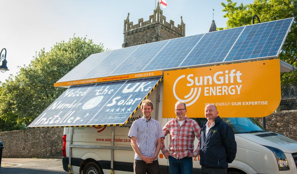 SunGift managing director Gabriel Wondrausch (centre) with Food and Familes Committee members Marc Perkins (left) and Ruud Jansen Venneboer (right) in front of Ottery St Mary Parish Church