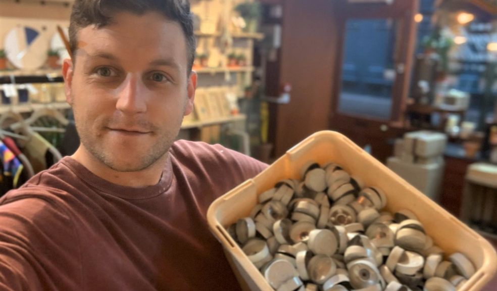 Man holding box of tealights