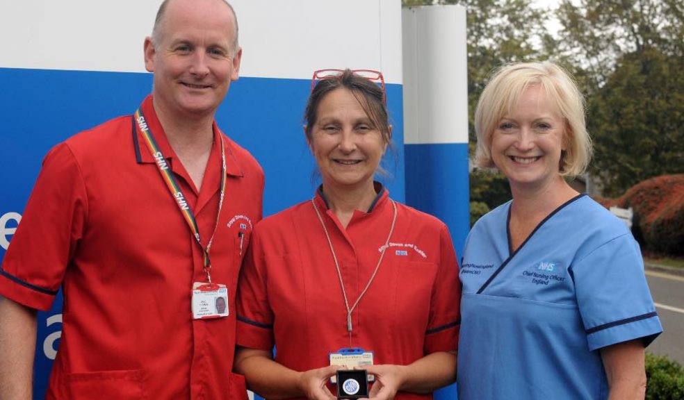Tina Grose (centre), with Interim Chief Nurse at the RD&E, Dave Thomas, and Chief Nursing Officer for England, Ruth May.