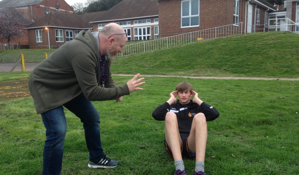 Tony Whiteley, Exeter Deaf Academy Student Care Worker training Deaf student William ahead of the Escot Mud Run