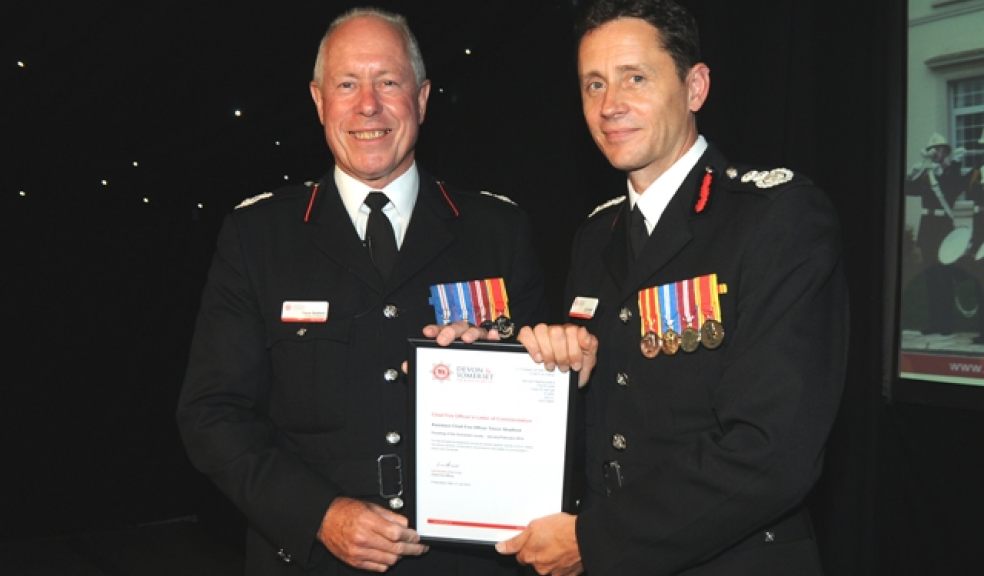 Trevor (left) receiving a Chief Officer’s Letter of Commendation from Chief Fire Officer Lee Howell (right).
