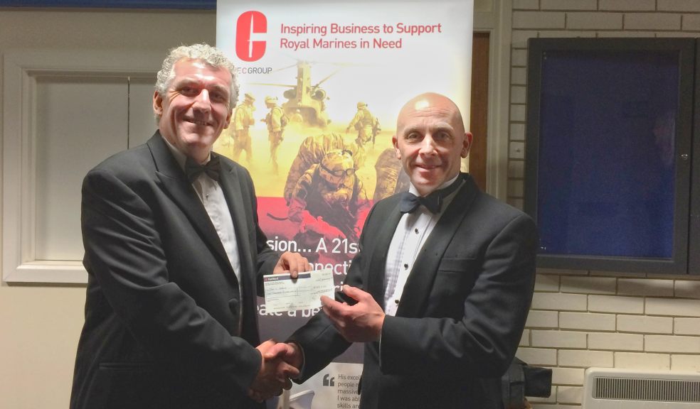 Barry Woodward, Van Guard MD, presents a cheque for £1,000 to Sharky Ward, The C Group's Director of Operations