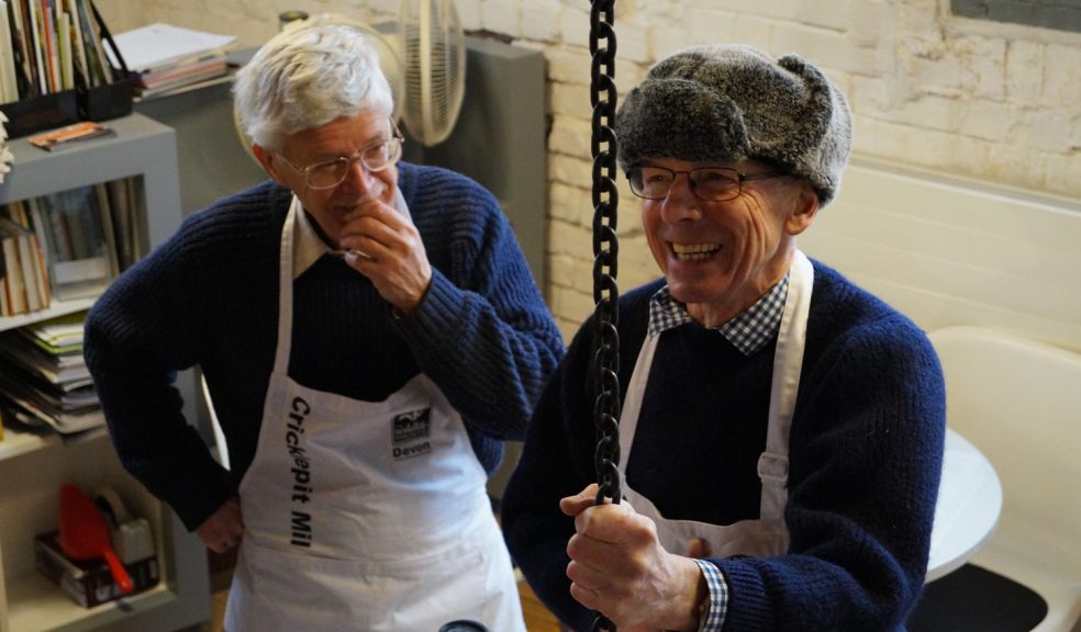 Volunteer millers (Peter Watson left and Nigel Fitzhugh right).