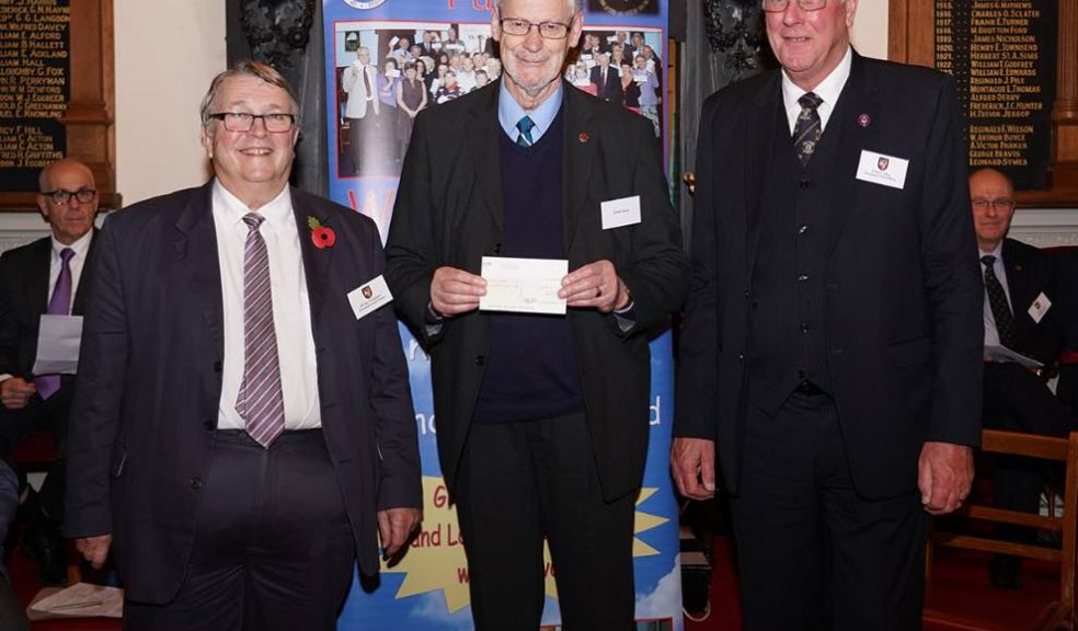 Peter Holman receiving the cheque from Ian Kingsbury accompanied by W. Bro. Clive Eden from St. Michaels Lodge in Dawlish.