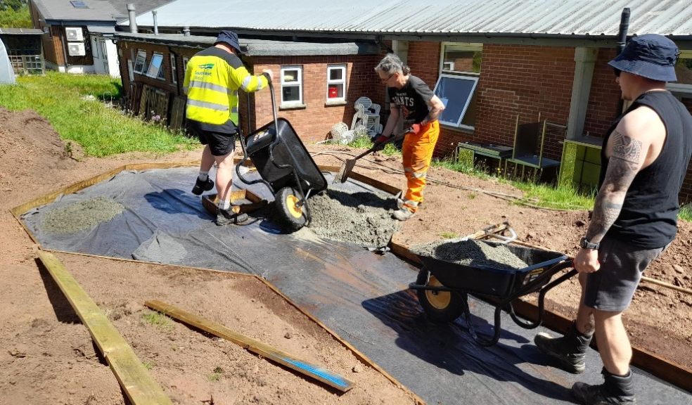 Westbank Community Allotment - three volunteers from Kier laying the new pathway. Photo supplied by Kier.