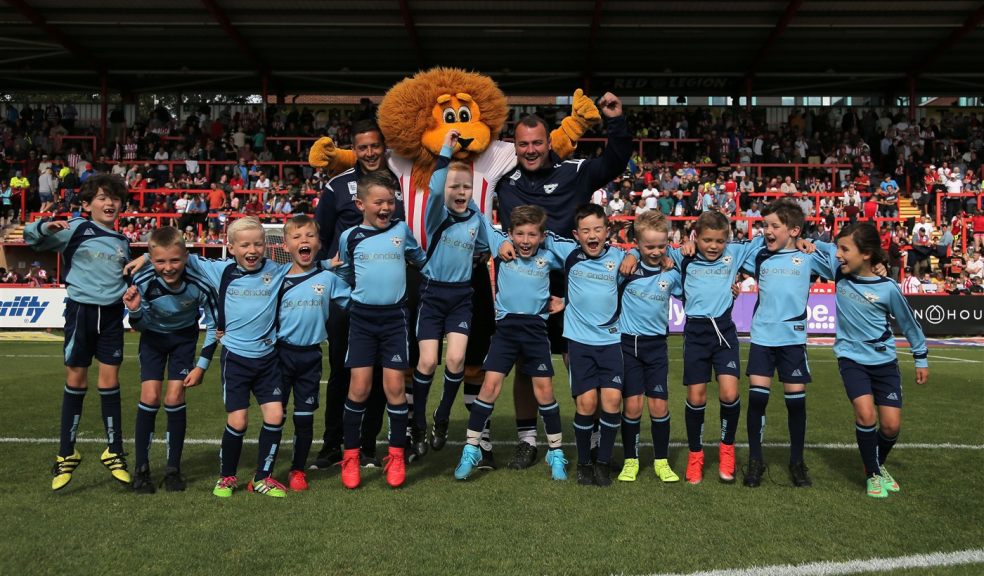 West Exe Team Match Day VIP Package with Exeter City Community Trust Football team on pitch