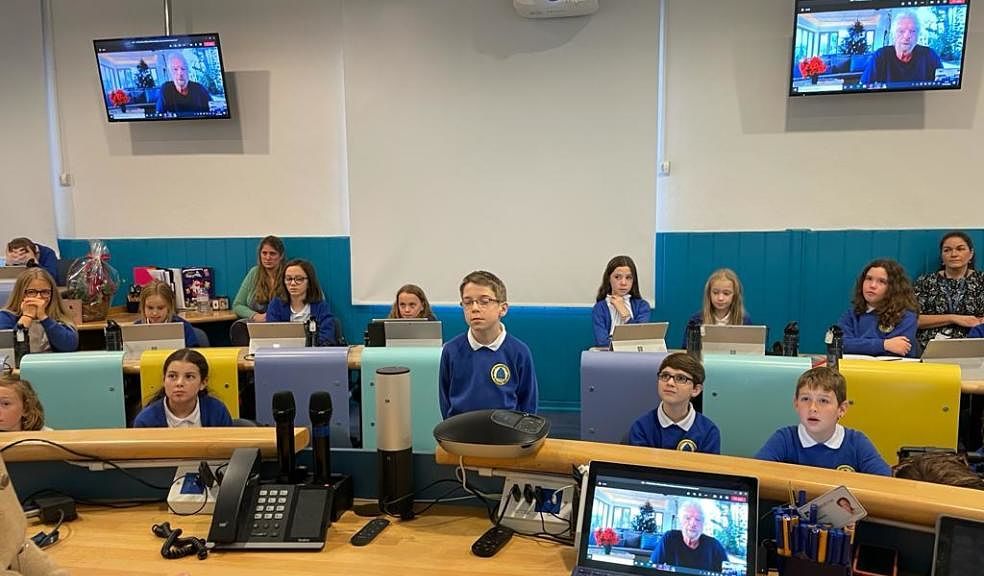 Jake (centre) talking to Sir Richard (onscreen) in the classroom