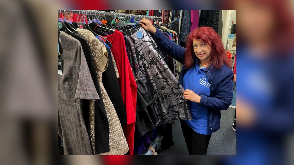 FORCE Charity Shop volunteer Jan Liff amid this year's bargains