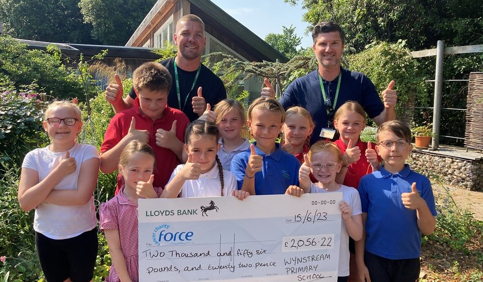 Wynstream School children present a cheque to FORCE Cancer Charity