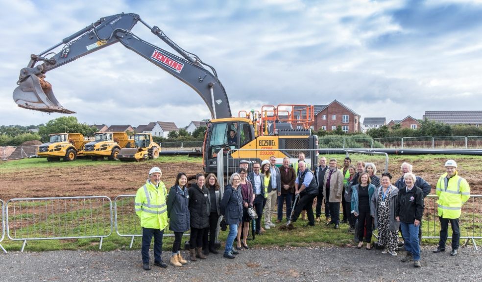 Representatives from - Acheson Construction, HDDL, East Devon District Council, Cranbrook Town Council, Cranbrook Education Campus, Devon County Council, Mono Project Management, Baker Ruff Hannon, SGP Architects, Brookbanks Consulting and LiveWest standing together to mark the occasion.