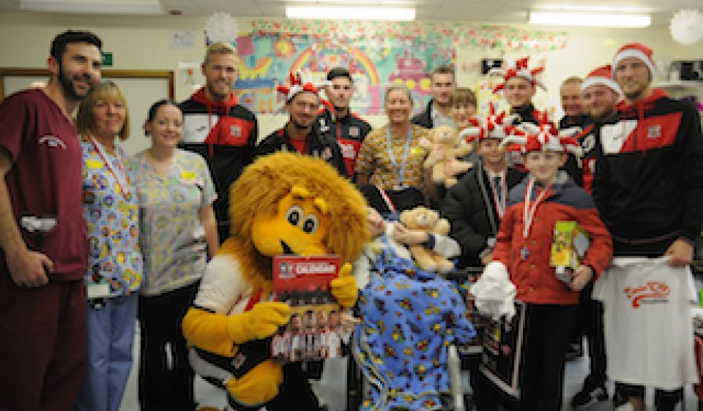 Exeter City FC players with staff and children of Bramble Ward
