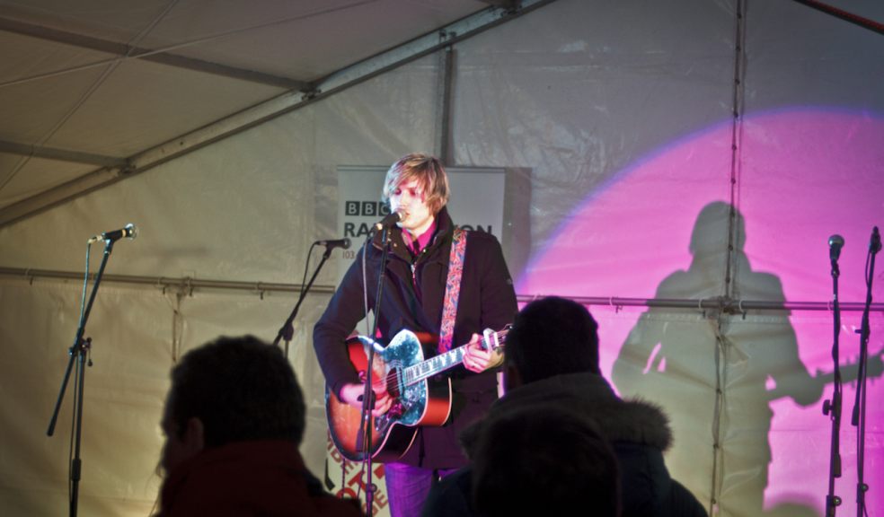 Adam Isaac performing at the Exeter Sleep Easy event last month