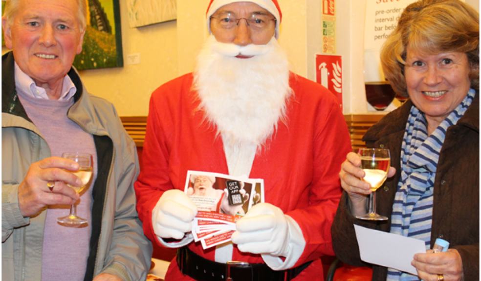 Santa with two members of the audience at the Manor Pavilion