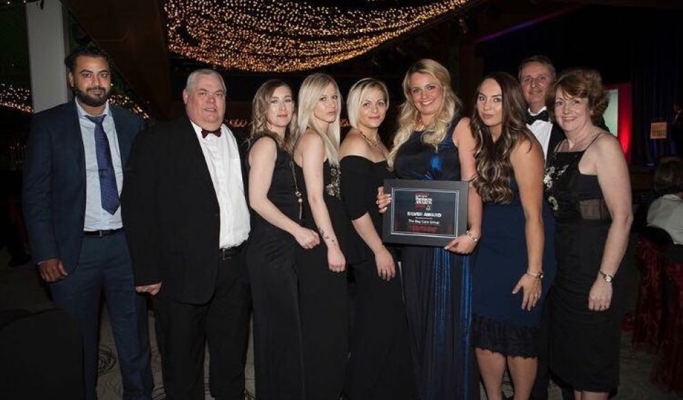 Staff at Bay Care celebrate winning a local business award.