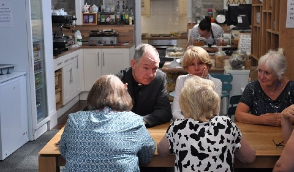 Bishop Robert meeting people at Trading Routes cafe, Plymouth